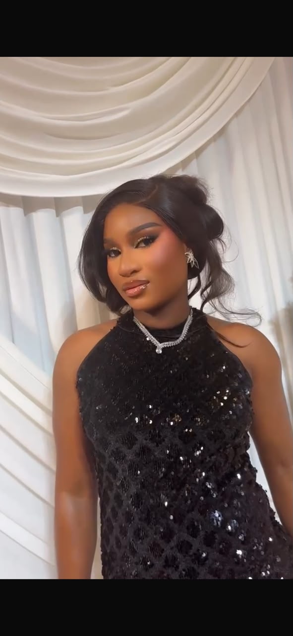 A close-up of you in a sparkling black dress